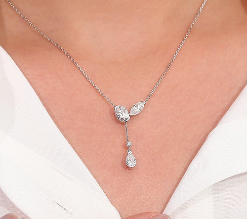 Y-shaped necklace set in 14k white gold with three diamonds